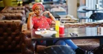 stylish-african-woman-in-red-shirt-and-hat-2023-11-27-05-28-47-utc1140x600