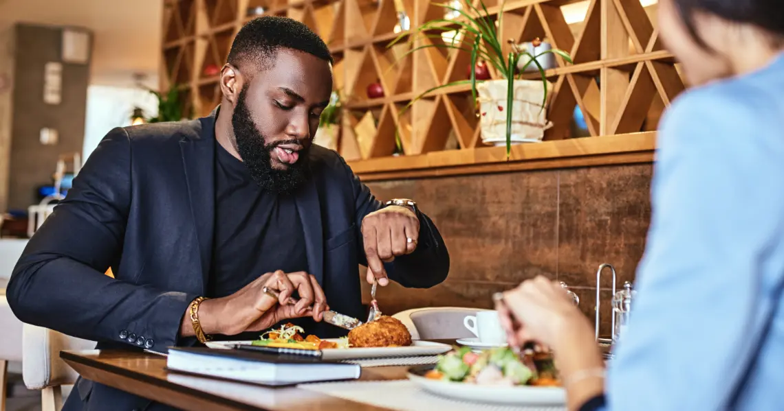 two-colleagues-having-lunch-in-company-s-restauran-2023-11-27-05-15-40-utc1140x600